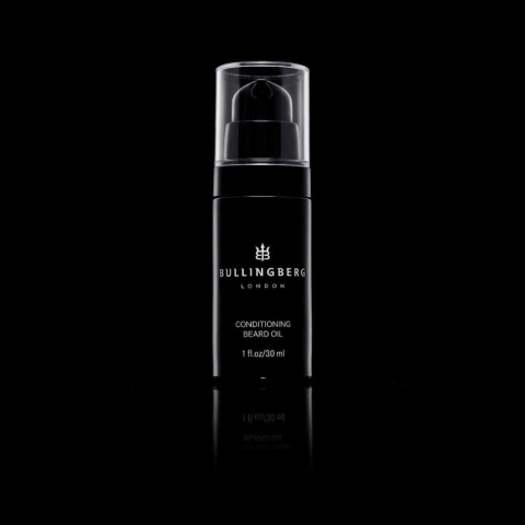 Black bottle on black background. Product photography to showcase Mens Grooming Branding.