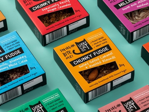 Food packaging cartons displayed to showcase new Packaging design and identity design for Lucky Cat Co.